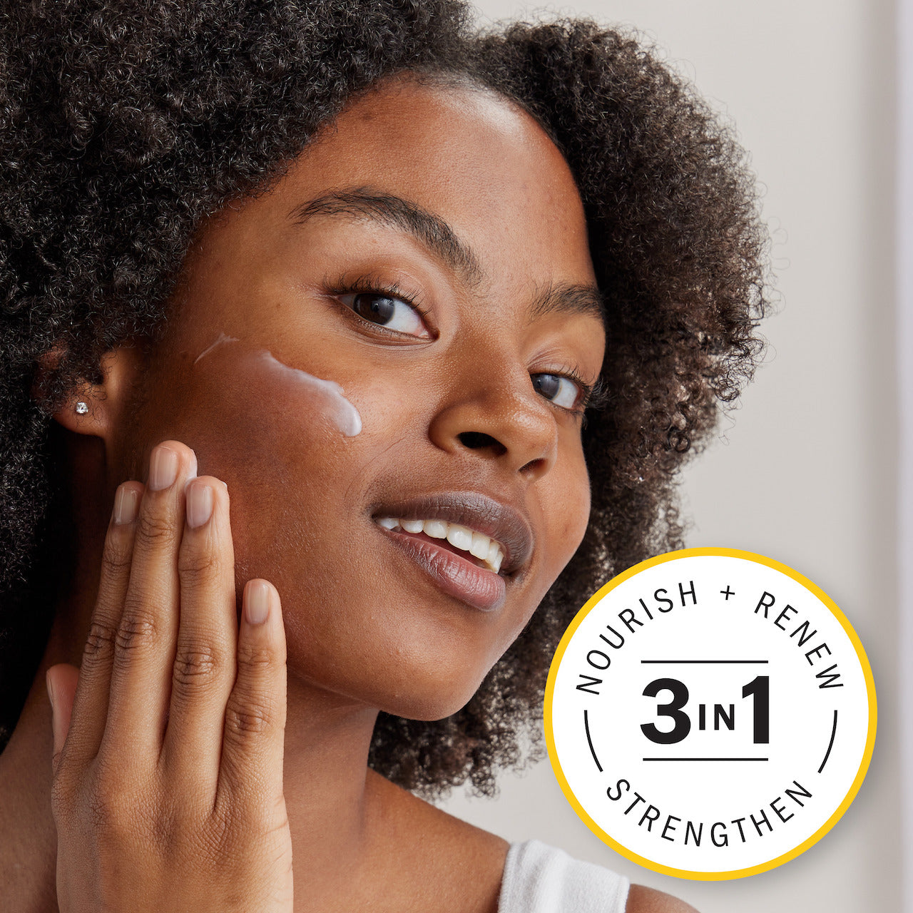 Model applying Olay Complete + Hydrating Lotion to face. 3 in 1 nourish, renew, strengthen. Model applying Olay Complete + Hydrating Lotion to face. 3 in 1 nourish, renew, strengthen.