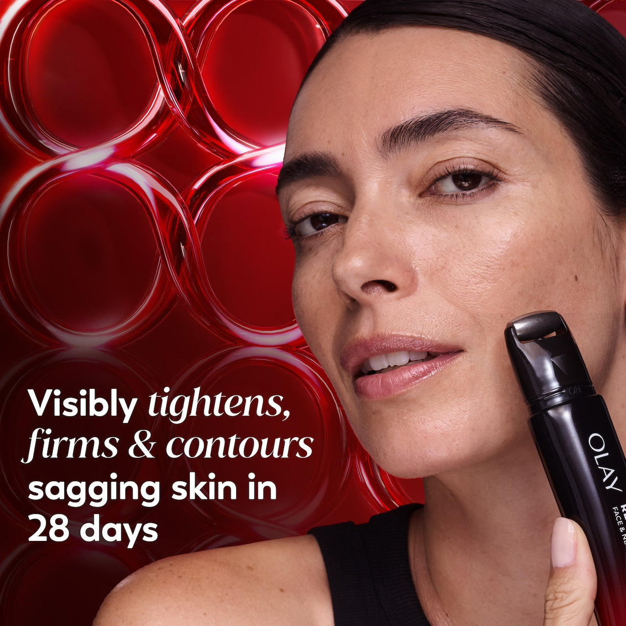 Model posing using Regenerist Face & Neck Lifting Treatment roller on face. Visibly tightens, firms and contours, sagging skin in 28 days Model posing using Regenerist Face & Neck Lifting Treatment roller on face. Visibly tightens, firms and contours, sagging skin in 28 days