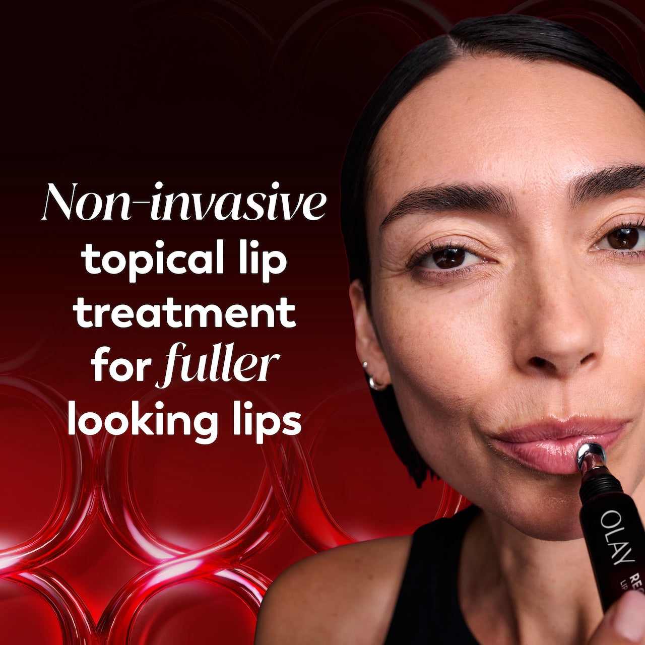 Model posing applying Regenerist Lip Plumping Treatment. Non invasive topical lip treatment for fuller looking lips Model posing applying Regenerist Lip Plumping Treatment. Non invasive topical lip treatment for fuller looking lips