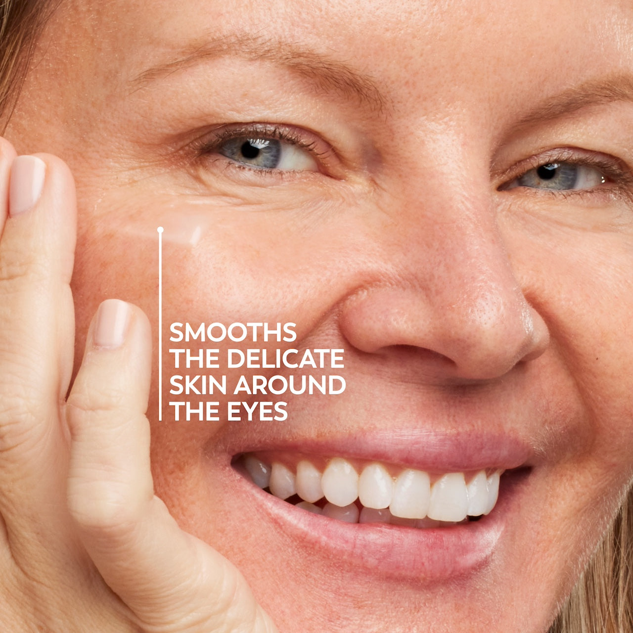 Model posing and smiling. Smooths the delicate skin around the eyes Model posing and smiling. Smooths the delicate skin around the eyes