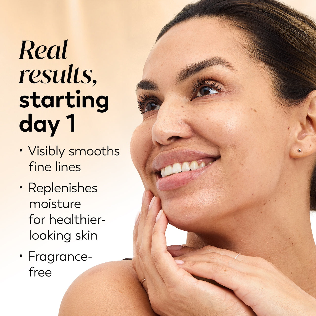Model posing and smiling. Real results starting day 1. Visibly smooths fine lines. Replenishes moisture for healthier looking skin Model posing and smiling. Real results starting day 1. Visibly smooths fine lines. Replenishes moisture for healthier looking skin