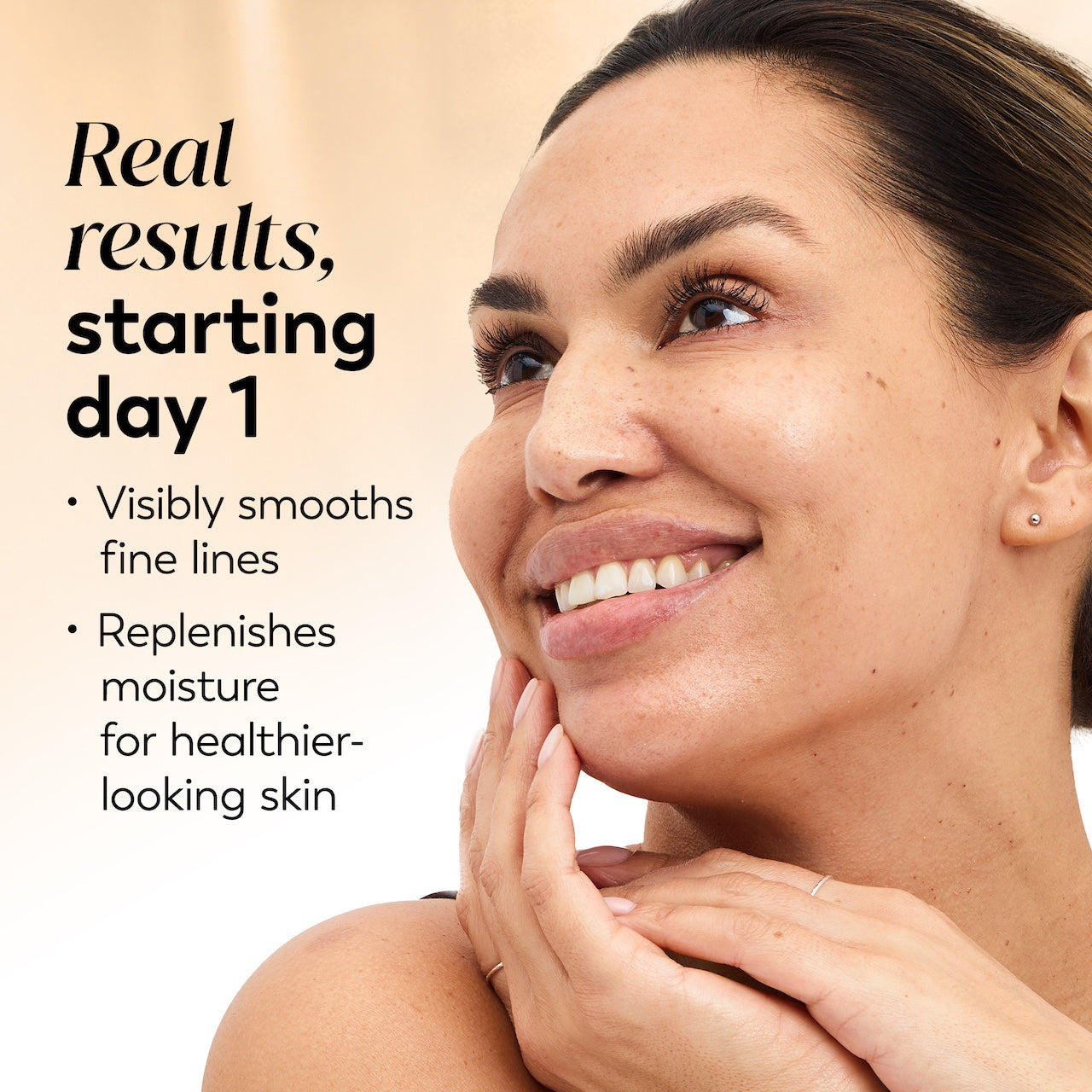 Model posing and smiling. Real results starting day 1. Visibly smooths fine lines. Replenishes moisture for healthier looking skin Model posing and smiling. Real results starting day 1. Visibly smooths fine lines. Replenishes moisture for healthier looking skin