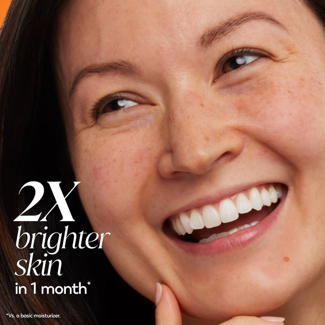 Model posing smiling. 2x brighter skin in 1 month* *Vs a basic moisturizer. Model posing smiling. 2x brighter skin in 1 month* *Vs a basic moisturizer.