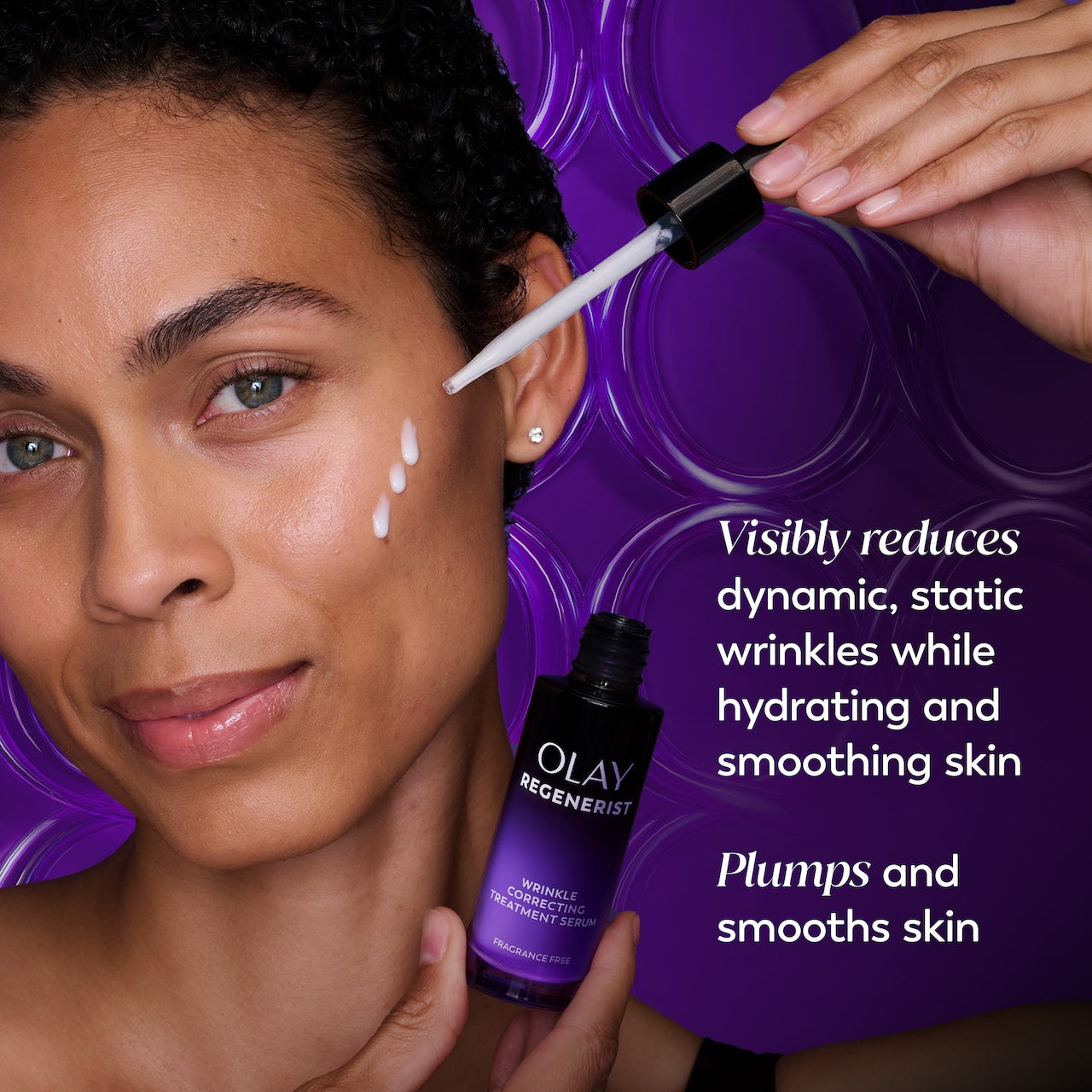 Model posing using Regenerist Wrinkle Correcting Night Treatment bottle open showing dropper to apply serum on face. Visibly reduces dynamic, static wrinkles while hydrating and smoothing skin. Plumps and smooths skin. Model posing using Regenerist Wrinkle Correcting Night Treatment bottle open showing dropper to apply serum on face. Visibly reduces dynamic, static wrinkles while hydrating and smoothing skin. Plumps and smooths skin.