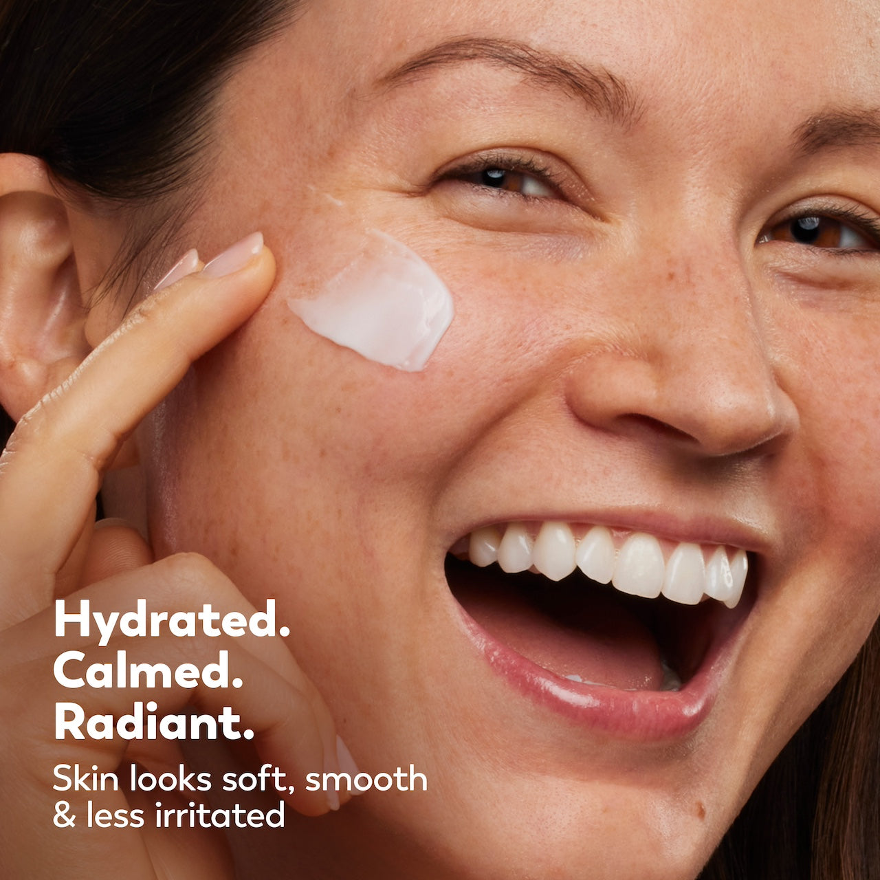Woman applying cream to her face with text 'Hydrated. Calmed. Radiant.' Woman applying cream to her face with text 'Hydrated. Calmed. Radiant.'
