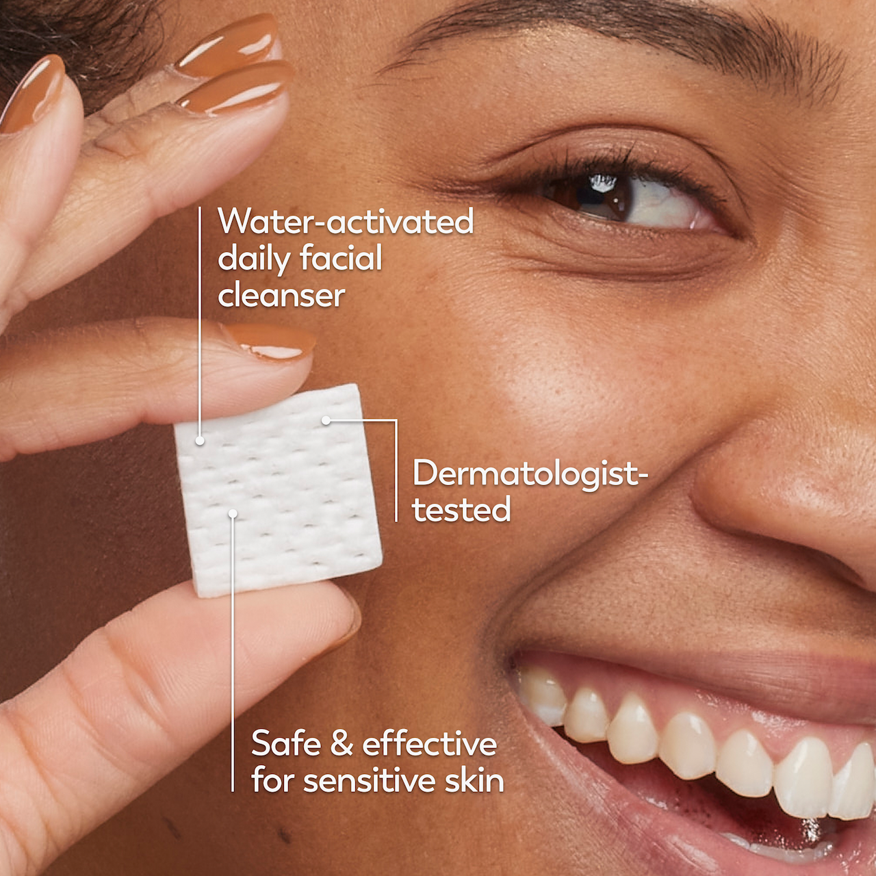Model posing and smiling while holding melts cleanser swatch. Water activated daily facial cleanser. Dermatologist tested. Safe and effective for sensitive skin Model posing and smiling while holding melts cleanser swatch. Water activated daily facial cleanser. Dermatologist tested. Safe and effective for sensitive skin