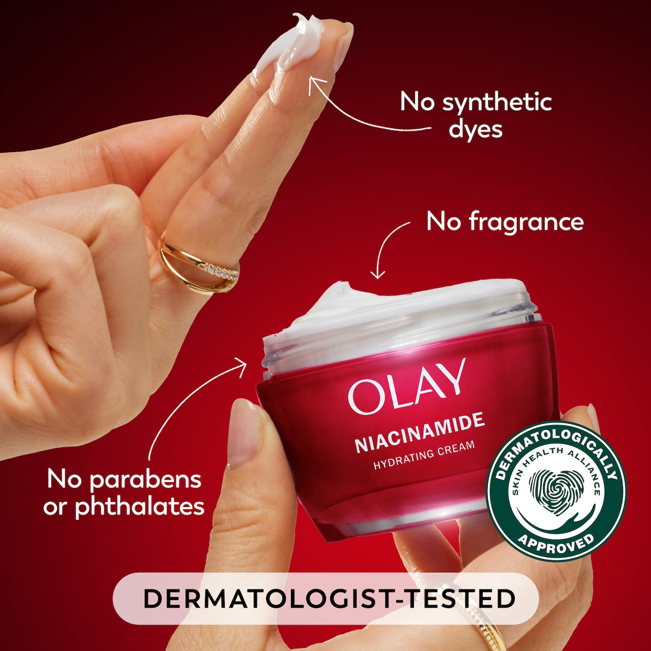 Model dipping fingers in Olay Niacinamide Hydrating Cream. No synthetic dyes. No fragrance, no parabens or phthalates. Dermatologist tested. Dermatologically approved. Model dipping fingers in Olay Niacinamide Hydrating Cream. No synthetic dyes. No fragrance, no parabens or phthalates. Dermatologist tested. Dermatologically approved.