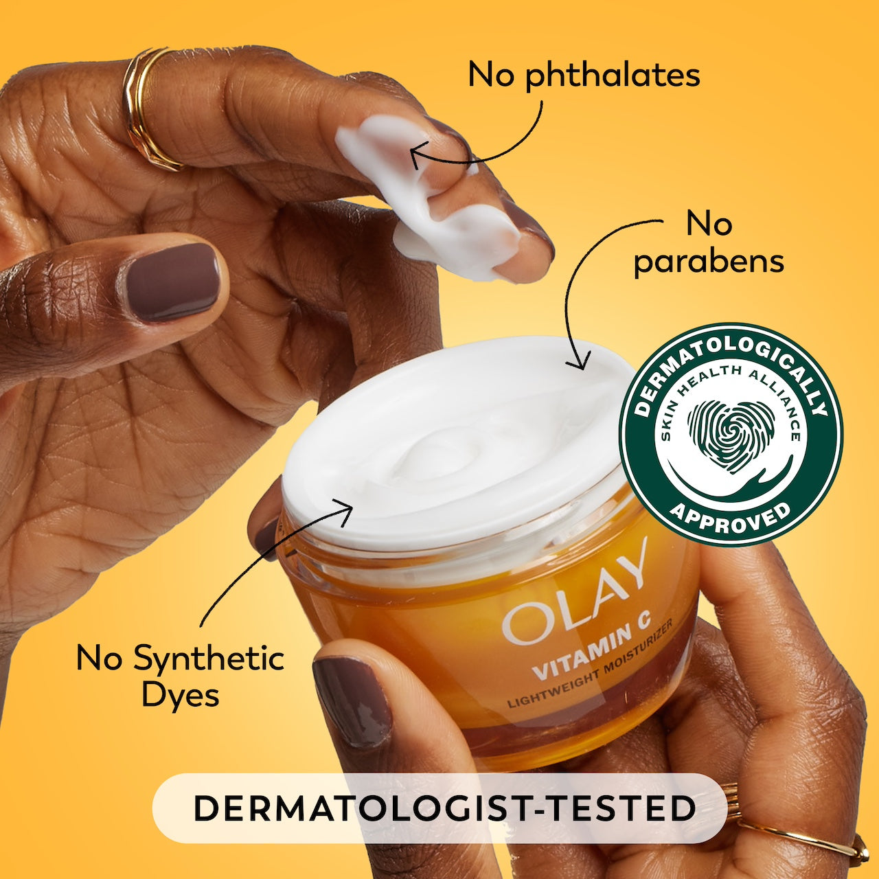 Model dipping fingers in Vitamin C moisturizer. No phthalates, no parabens, no synthetic dyes. Dermatologist tested. Dermatologically approved. Model dipping fingers in Vitamin C moisturizer. No phthalates, no parabens, no synthetic dyes. Dermatologist tested. Dermatologically approved.