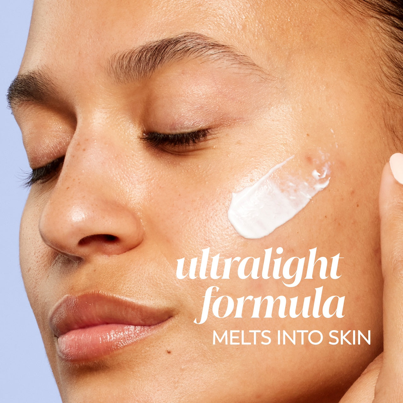 Model posing applying Olay Super Cream Mini with Sunscreen SPF 30, Ultra Lightweight SPF Face Moisturizer to face. Ultralight formula melts into skin Model posing applying Olay Super Cream Mini with Sunscreen SPF 30, Ultra Lightweight SPF Face Moisturizer to face. Ultralight formula melts into skin