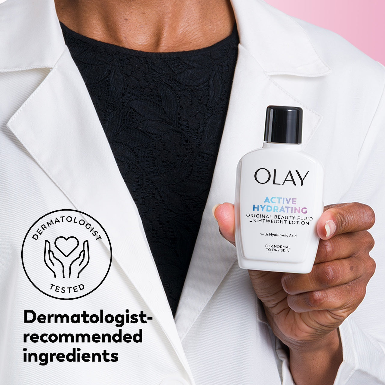 Person holding an Olay skincare product with a dermatologist-tested badge. Person holding an Olay skincare product with a dermatologist-tested badge.