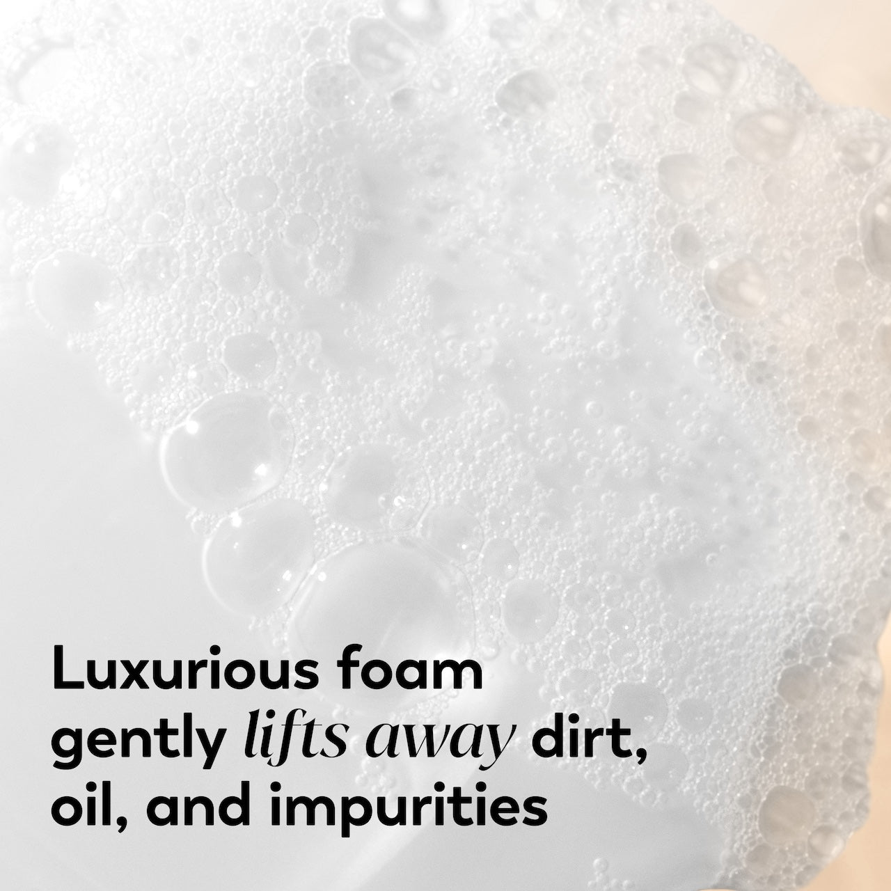 Close-up of luxurious foam with text indicating its cleaning properties. Close-up of luxurious foam with text indicating its cleaning properties.