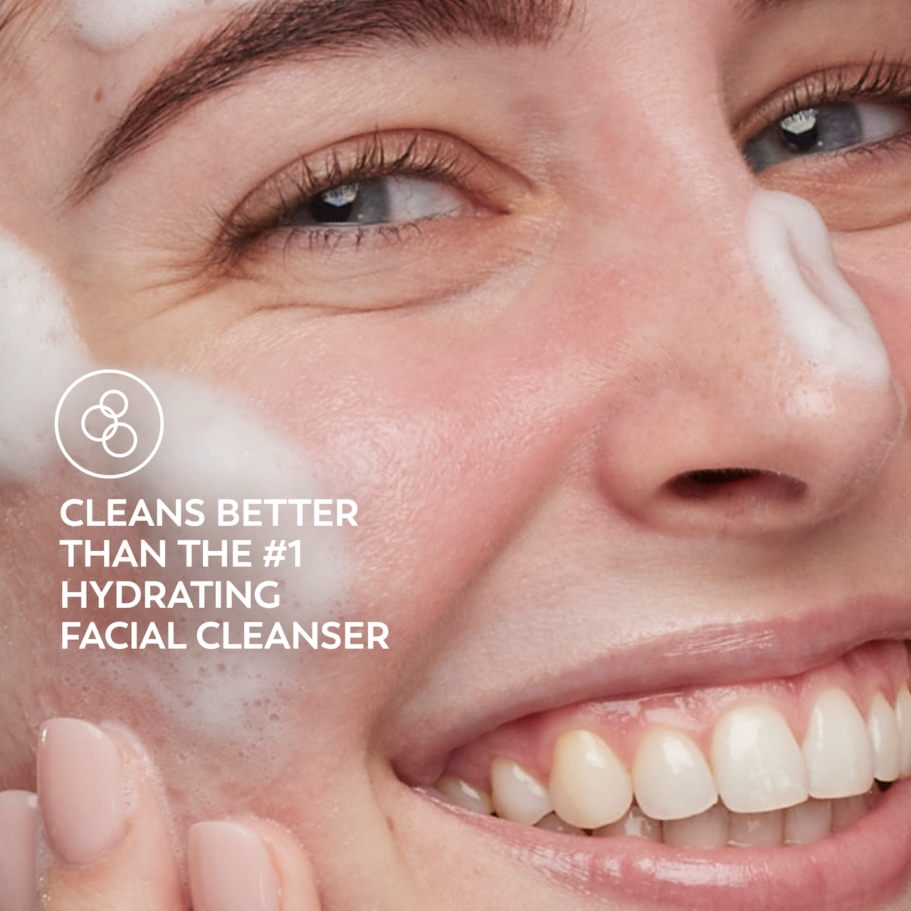 Model posing and smiling while applying melts cleanser to face. Cleans better than the #1 hydrating facial cleanser Model posing and smiling while applying melts cleanser to face. Cleans better than the #1 hydrating facial cleanser