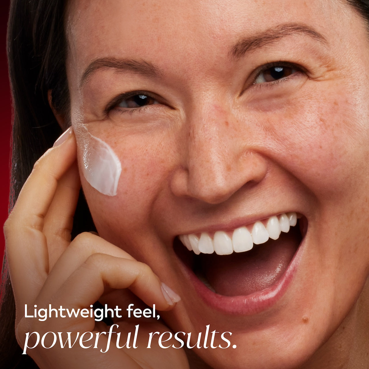 Model posing and smiling applying Olay Niacinamide Hydrating Cream to face. Lightweight feel. Powerful results. Model posing and smiling applying Olay Niacinamide Hydrating Cream to face. Lightweight feel. Powerful results.