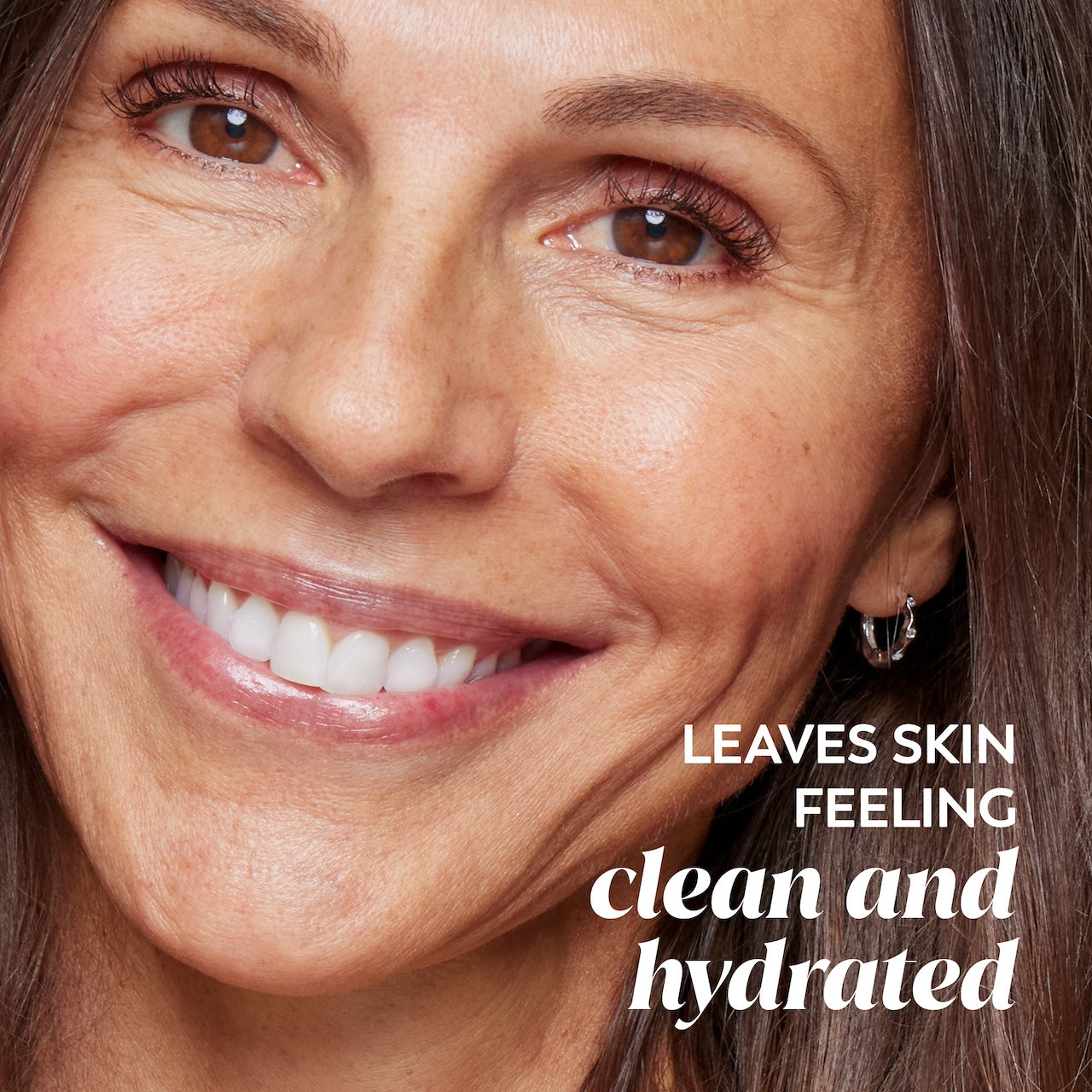 Model smiling. Leaves skin feeling clean and hydrated Model smiling. Leaves skin feeling clean and hydrated