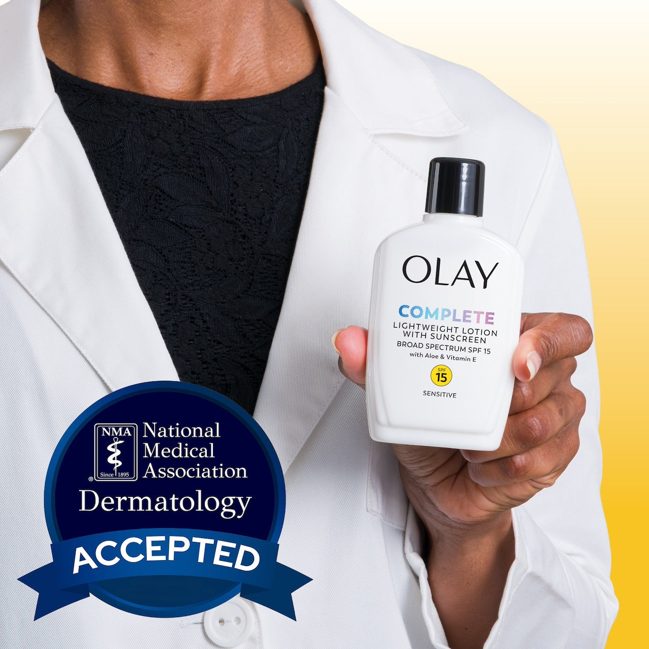 Model wearing lab coat holding Olay Complete Lotion Moisturizer with SPF 15 Sensitive bottle. National medical association dermatology accepted. Model wearing lab coat holding Olay Complete Lotion Moisturizer with SPF 15 Sensitive bottle. National medical association dermatology accepted.