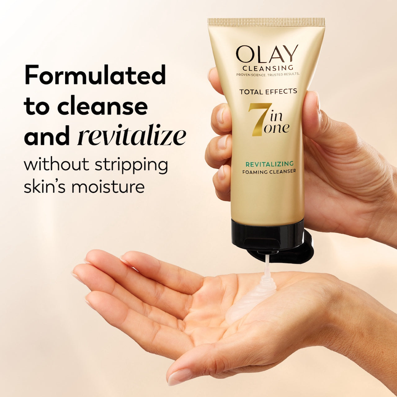 Olay cleansing tube being held over a hand with text about product benefits. Olay cleansing tube being held over a hand with text about product benefits.