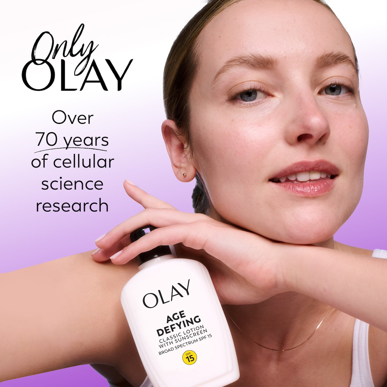 Woman applying Olay Age Defying lotion with text highlighting Olay's history. Woman applying Olay Age Defying lotion with text highlighting Olay's history.
