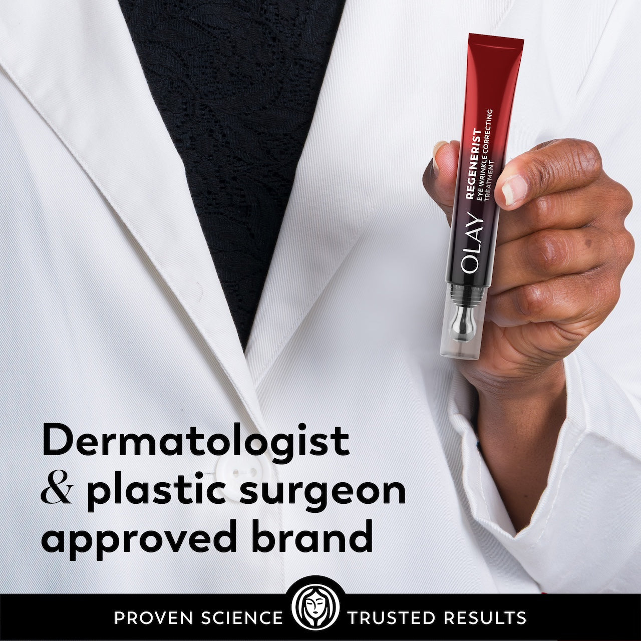 Model in lab coat holding Regenerist Eye Wrinkle Correcting Treatment applicator. Dermatologist and plastic surgeon approved brand. Model in lab coat holding Regenerist Eye Wrinkle Correcting Treatment applicator. Dermatologist and plastic surgeon approved brand.