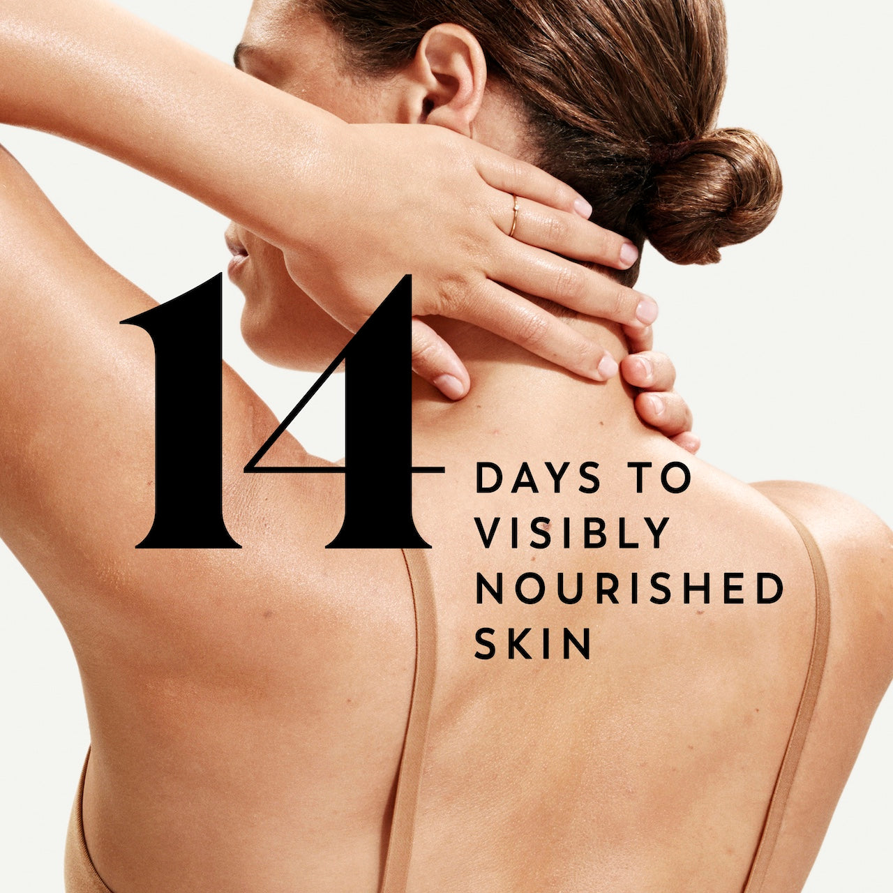 Model posing back facing showing nourished skin. 14 days to visibly nourished skin Model posing back facing showing nourished skin. 14 days to visibly nourished skin