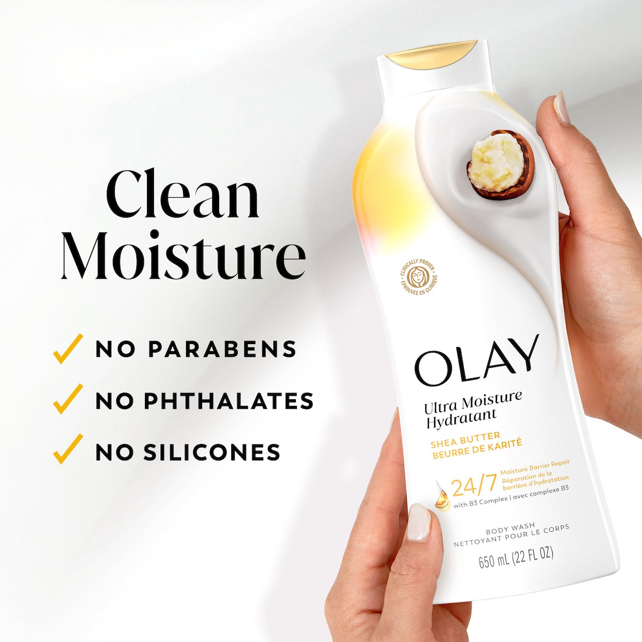 Model holding Ultra Moisture Body Wash Shea Butter bottle. Clean moisture. Parabens, phthalates, silicones. Model holding Ultra Moisture Body Wash Shea Butter bottle. Clean moisture. Parabens, phthalates, silicones.