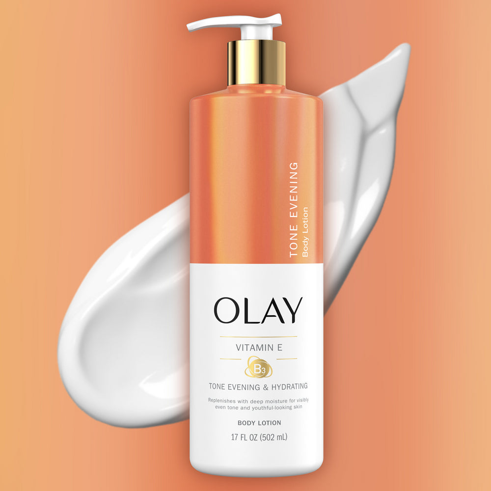 Olay body lotion bottle with pump on an orange background Olay body lotion bottle with pump on an orange background