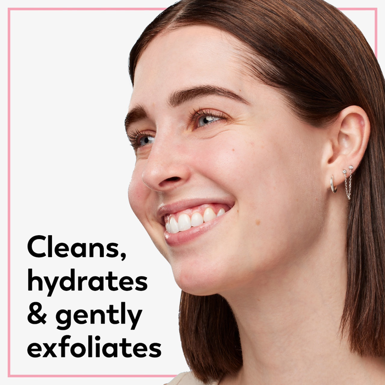 Model posing and smiling. Cleans, hydrates, and gently exfoliates.