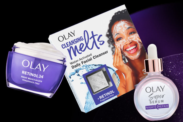 Olay skincare products including a jar, cleansing melts, and serum on a black background