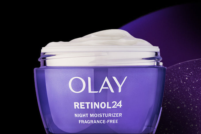 An open Olay Retinol24 Face Moisturizer jar with its cream appearing whipped on the top