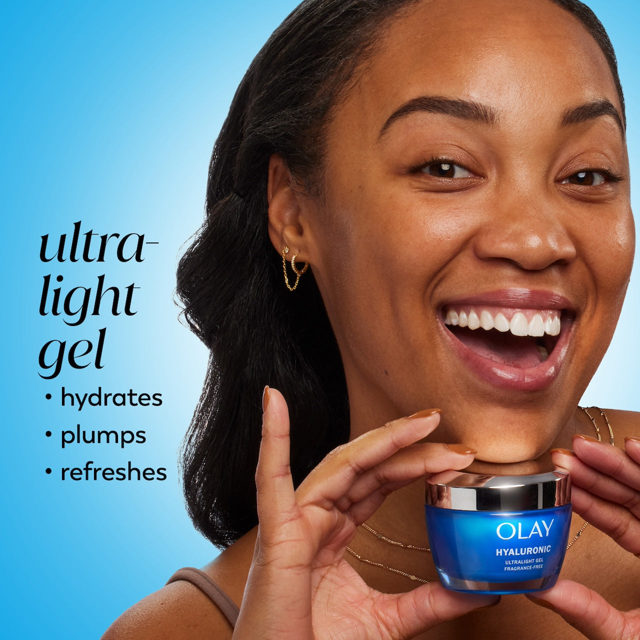 Model posing with Olay Hyaluronic Ultralight Gel jar. Ultra light gel hydrates, plumps, refreshes