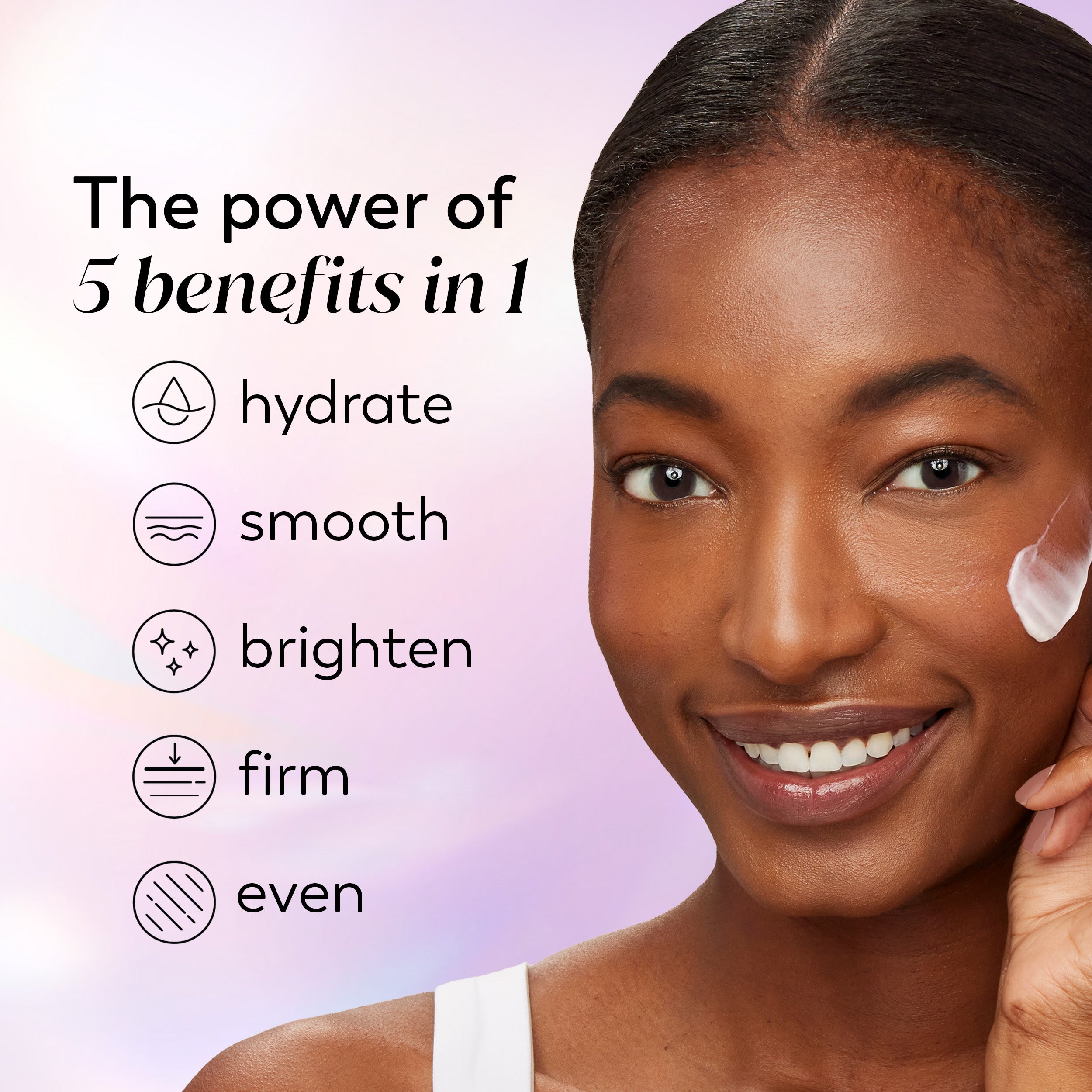 A close-up of a smiling woman with dark skin touching her cheek, with text on the left reading 'The power of 5 benefits in 1' and icons for hydrate, smooth, brighten, firm, and even. A small white cosmetic smear is visible on her cheek against a soft pink and lavender gradient background.