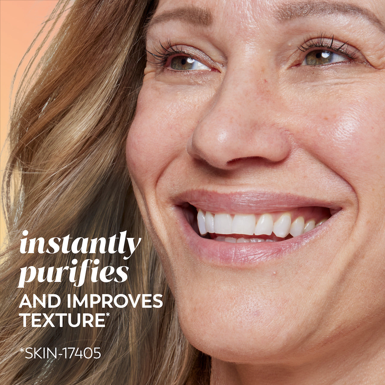Model smiling. Instantly purifies and improves texture*. *Skin-17405