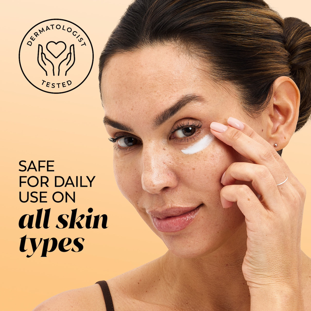 Model applying eye cream under eye. Safe for daily use on all skin types. Dermatologist tested.