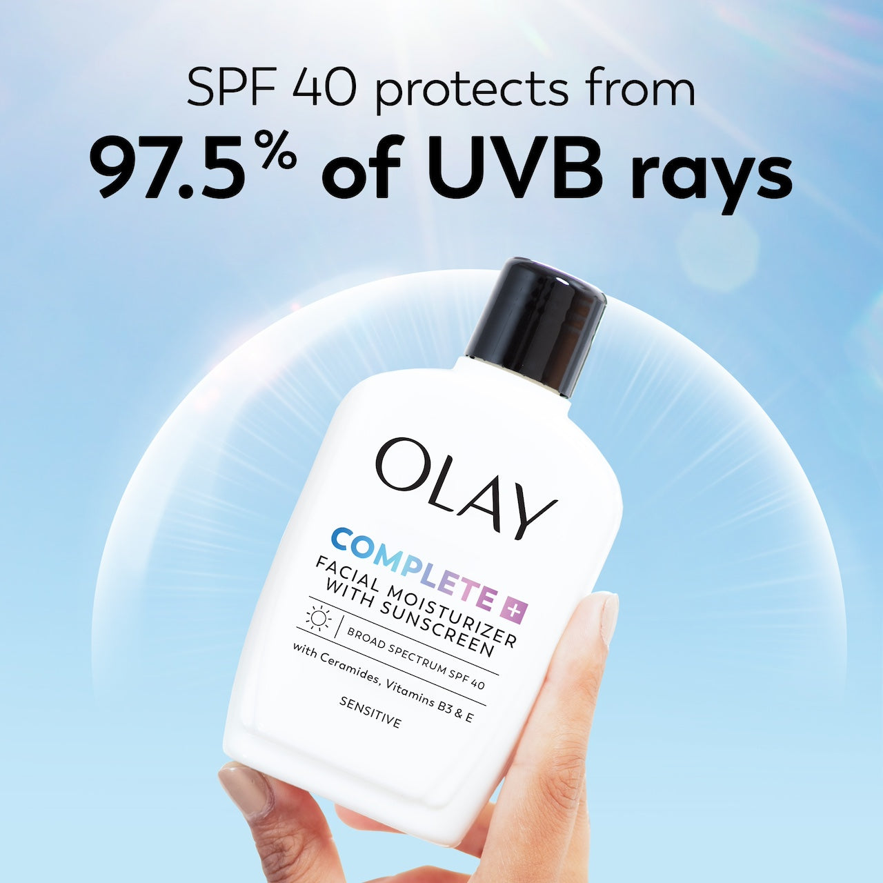 Olay Complete + Daily Facial Moisturizer with Sunscreen SPF 40 bottle in hand. SPF 40 protects from 97.5% of UVB rays