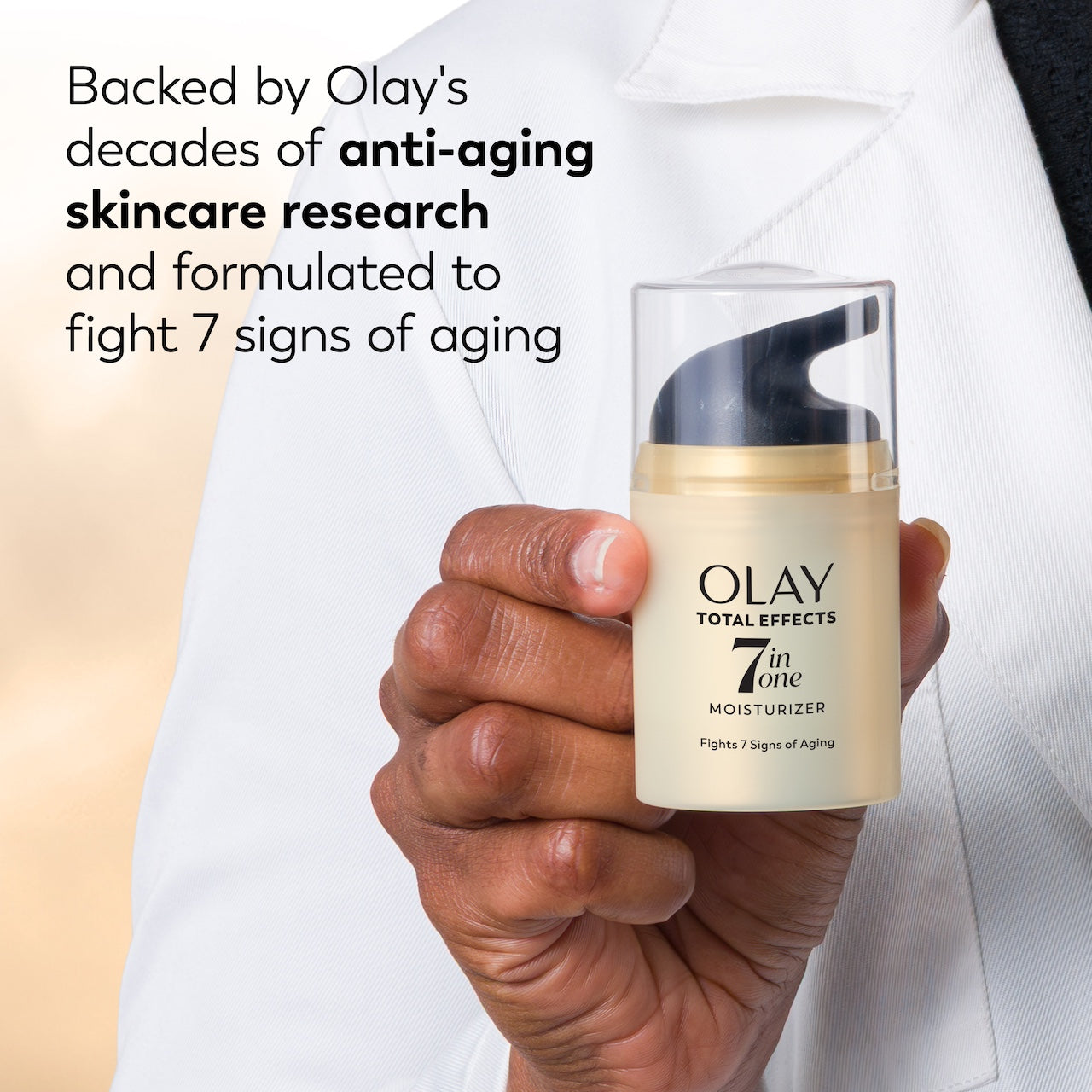 Total Effects Face Moisturizer Original bottle in hand. Backed by Olay's decades of anti aging skincare research and formulated to fight 7 signs of aging