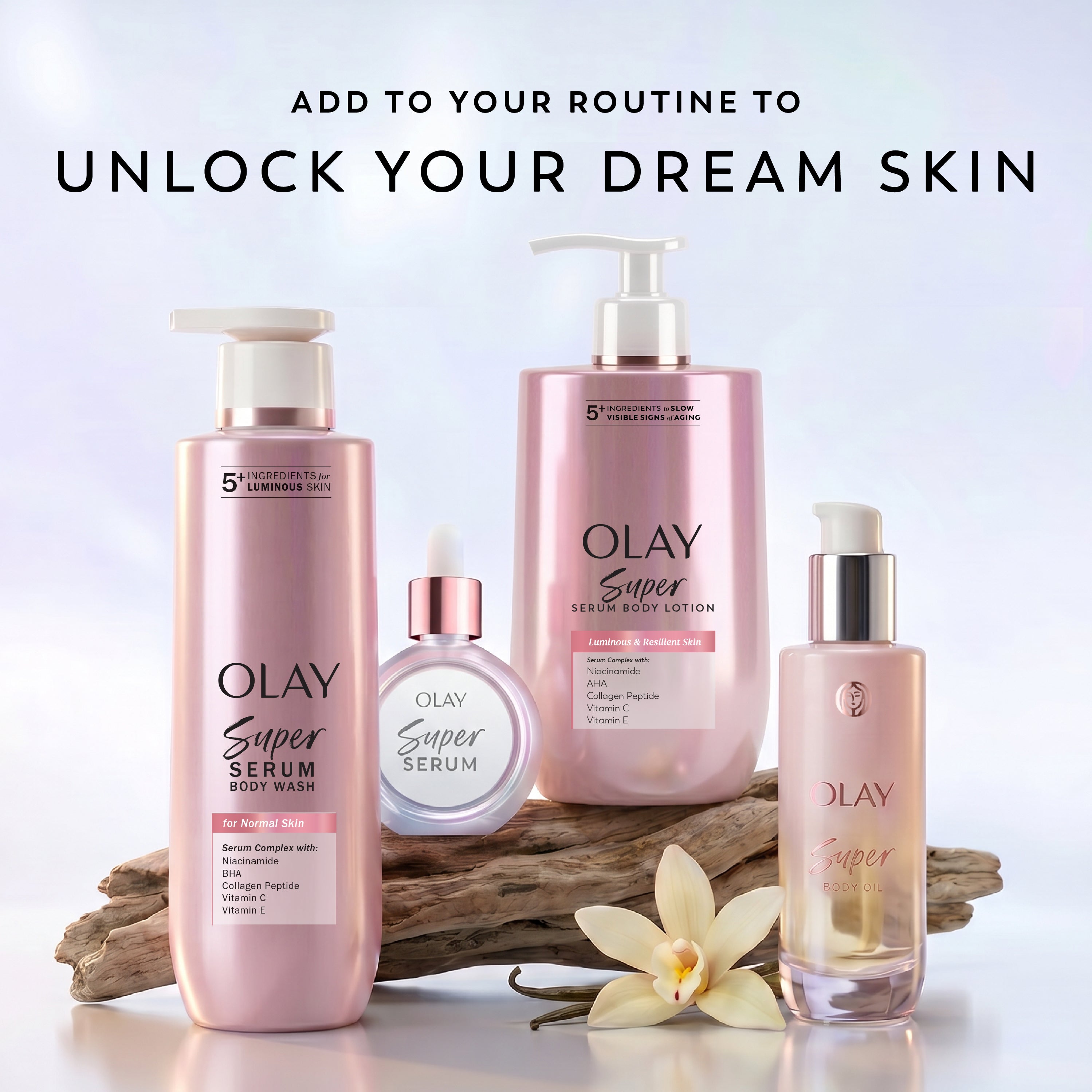 Four Olay Super Serum skincare products arranged on a light studio background with decorative wood and a white flower. The products include a pump bottle, a round bottle, a pump dispenser, and a dropper bottle, all in soft pink packaging with white and rose-gold details.