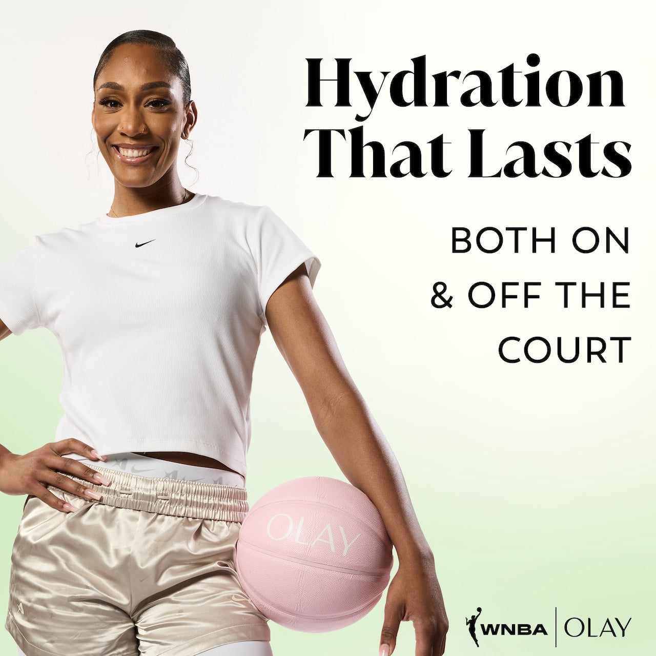 A'jA Wilson posing with basketball smiling. Hydration that lasts both on and off the court