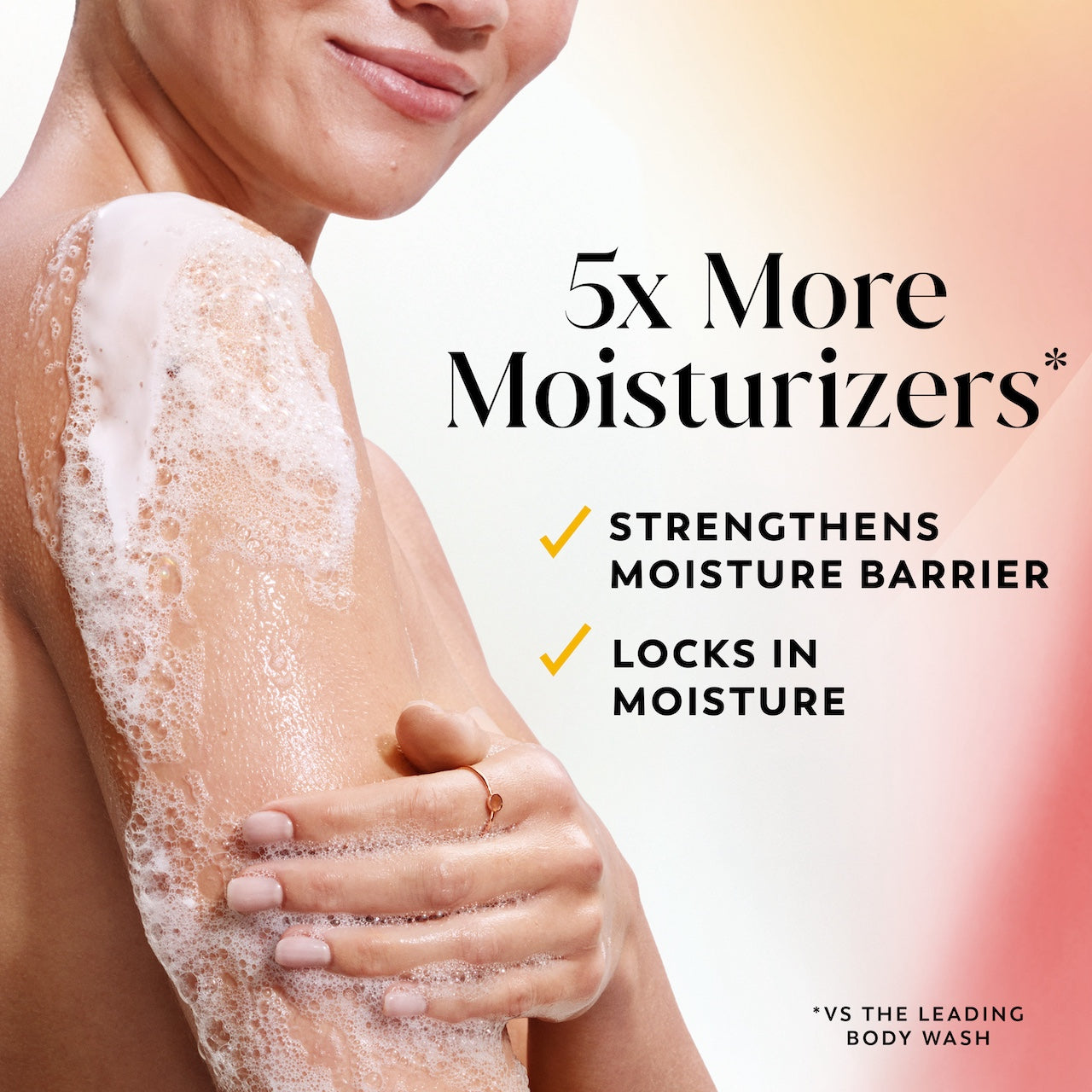 Model posing lathering arm with body wash. 5x more moisturizers* Strengthens moisture barrier. Locks in moisture. *vs the leading body wash.
