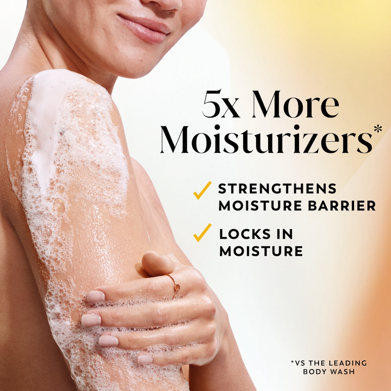 Model posing lathering arm with body wash. 5x more moisturizers* Strengthens moisture barrier. Locks in moisture. *vs the leading body wash.