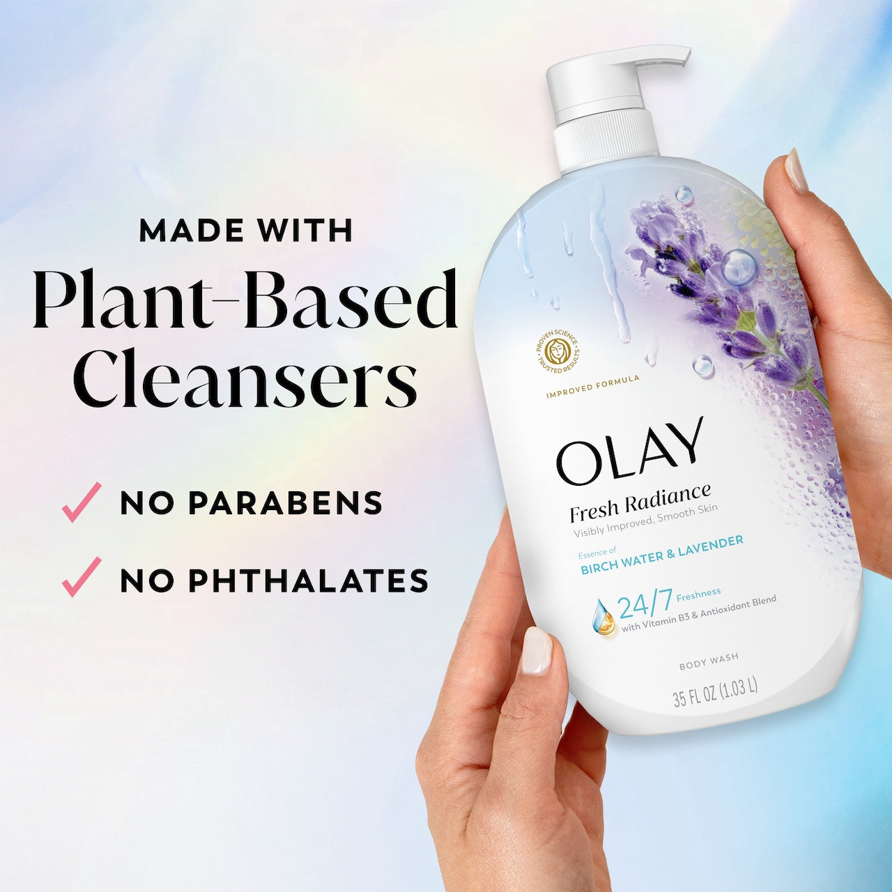 Model holding Fresh Radiance Body Wash bottle. Made with plant based cleansers. No parabens, no phthalates
