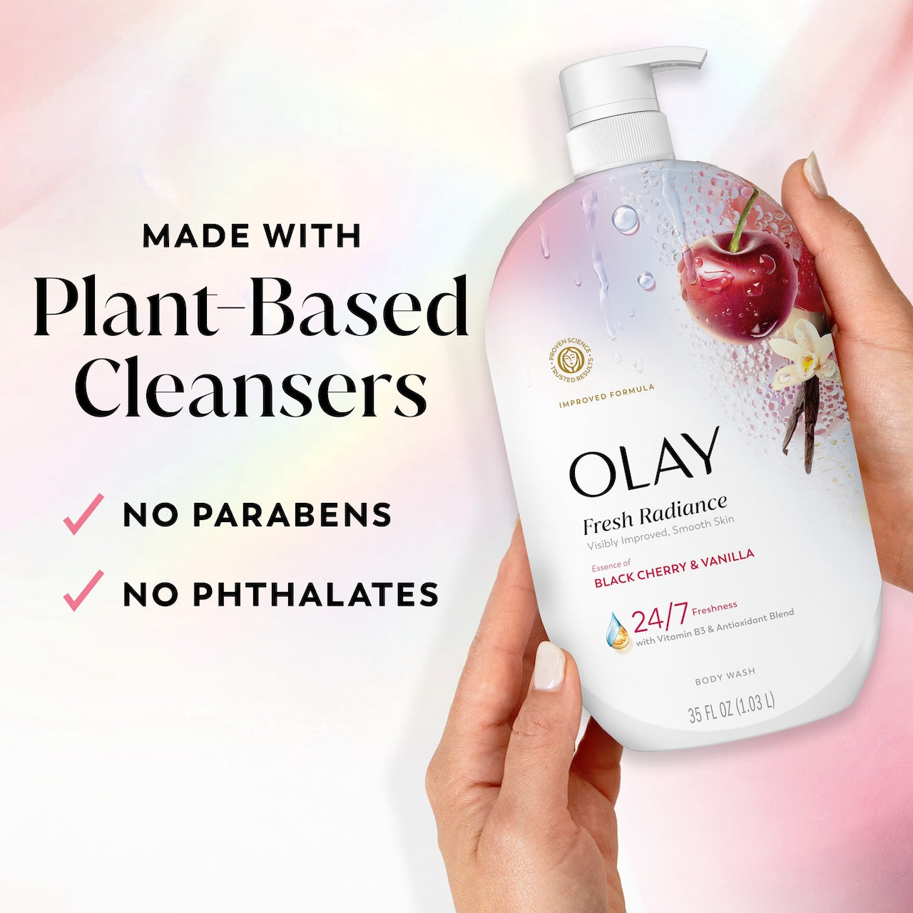 Model holding Fresh Radiance Body Wash bottle. Made with plant based cleansers. No parabens, no phthalates