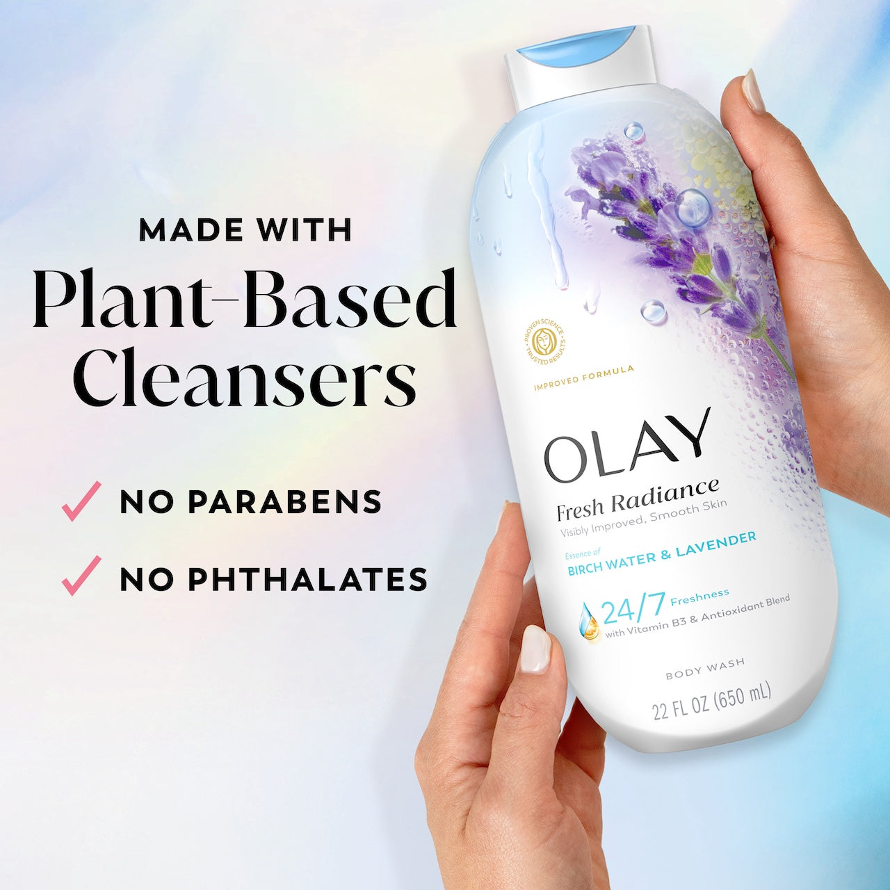 Model holding Fresh Radiance Body Wash bottle. Made with plant based cleansers. No parabens, no phthalates