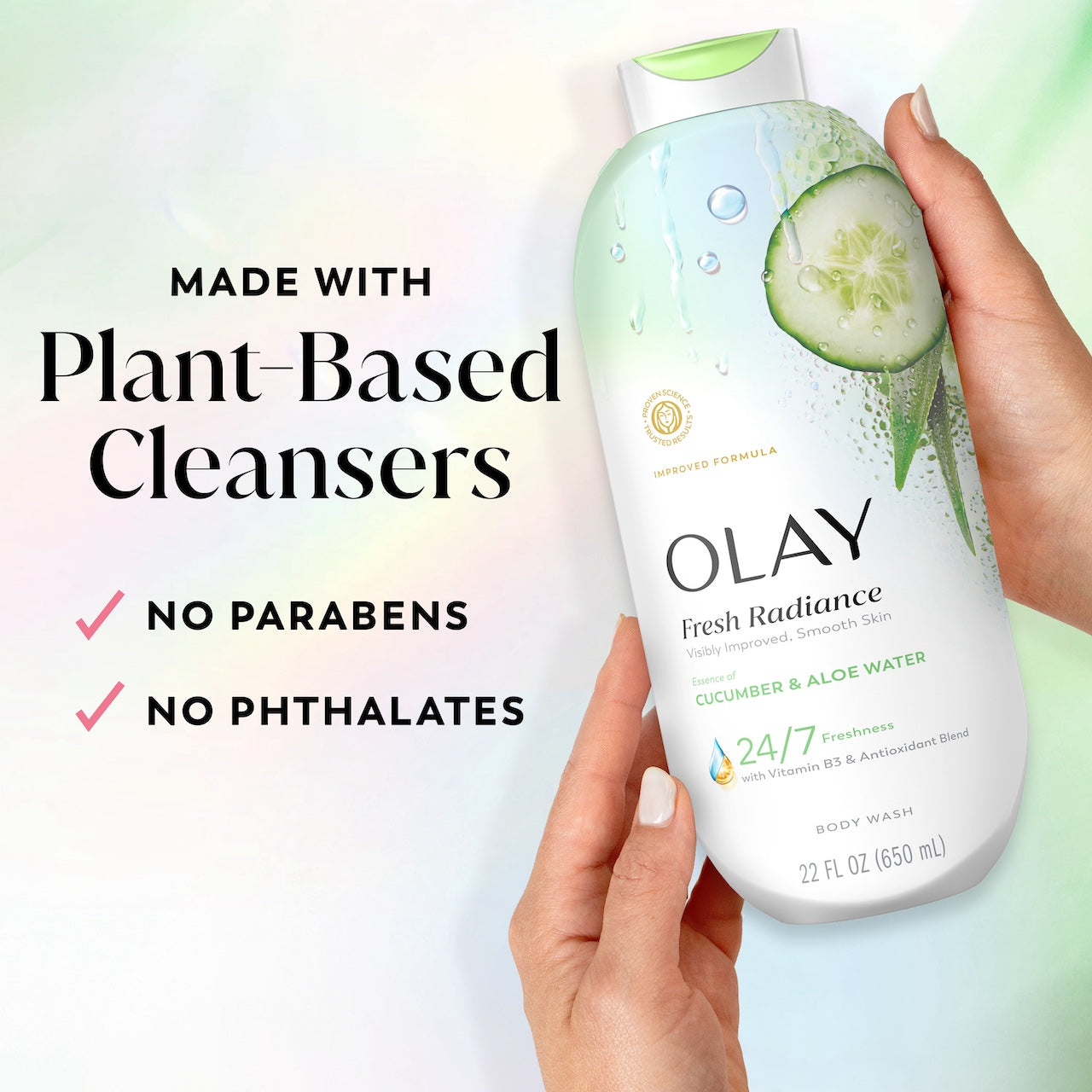 Model holding Fresh Radiance Body Wash bottle. Made with plant based cleansers. No parabens, no phthalates