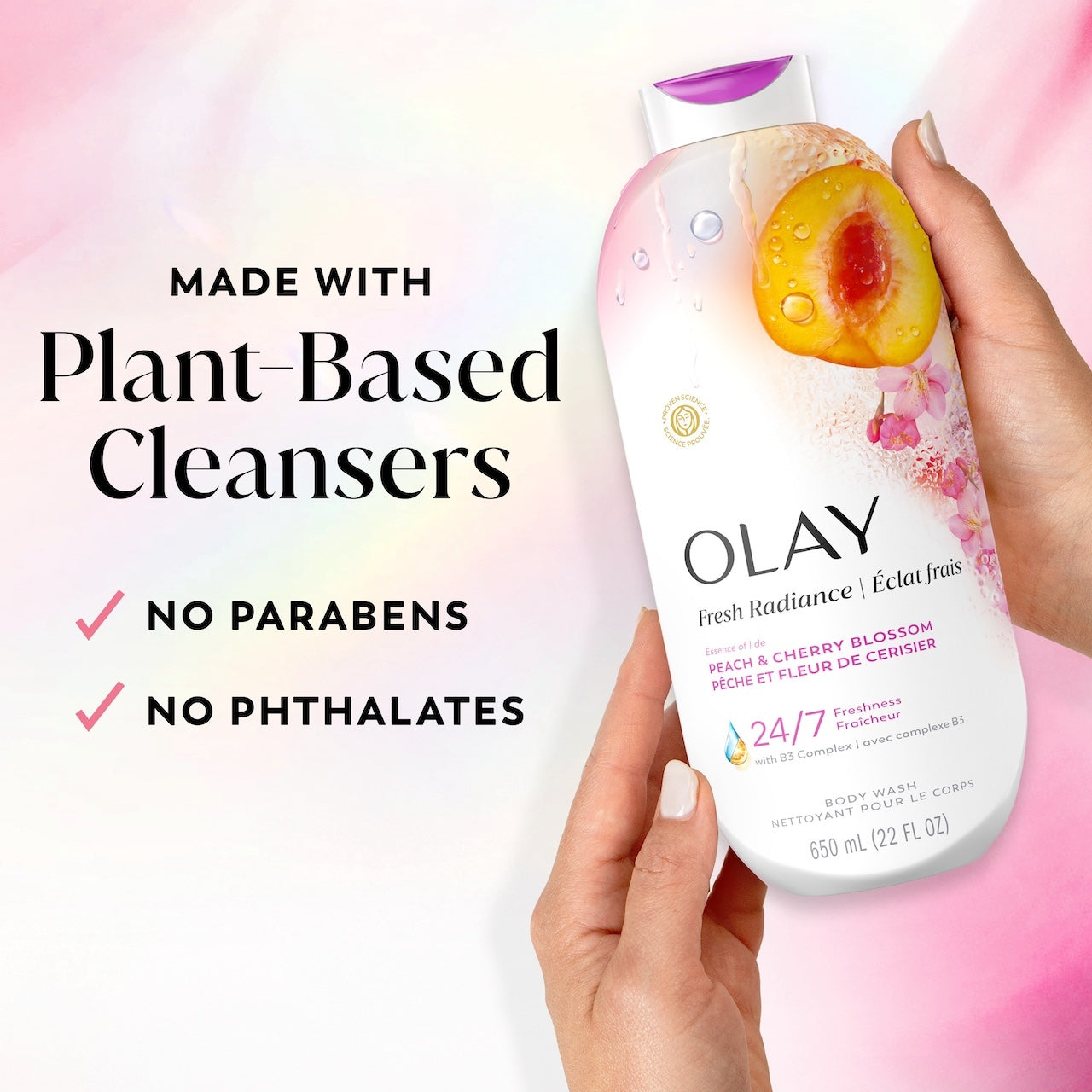 Model holding Fresh Radiance Body Wash bottle. Made with plant based cleansers. No parabens, no phthalates