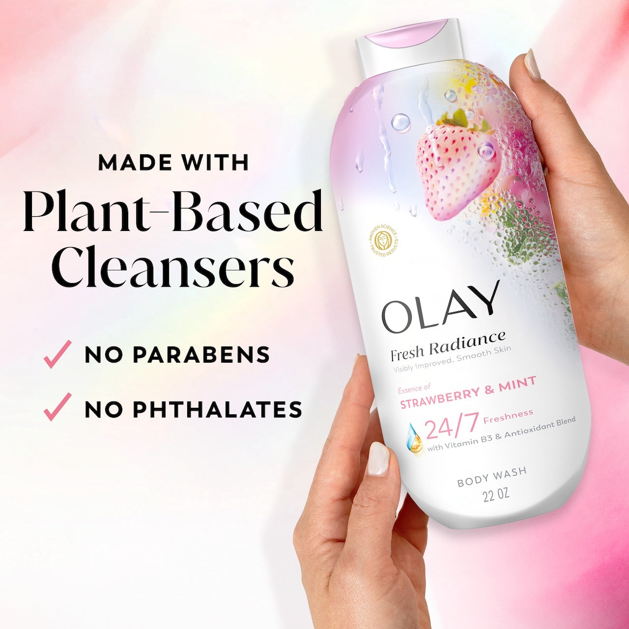 Model holding Fresh Radiance Body Wash bottle. Made with plant based cleansers. No parabens, no phthalates
