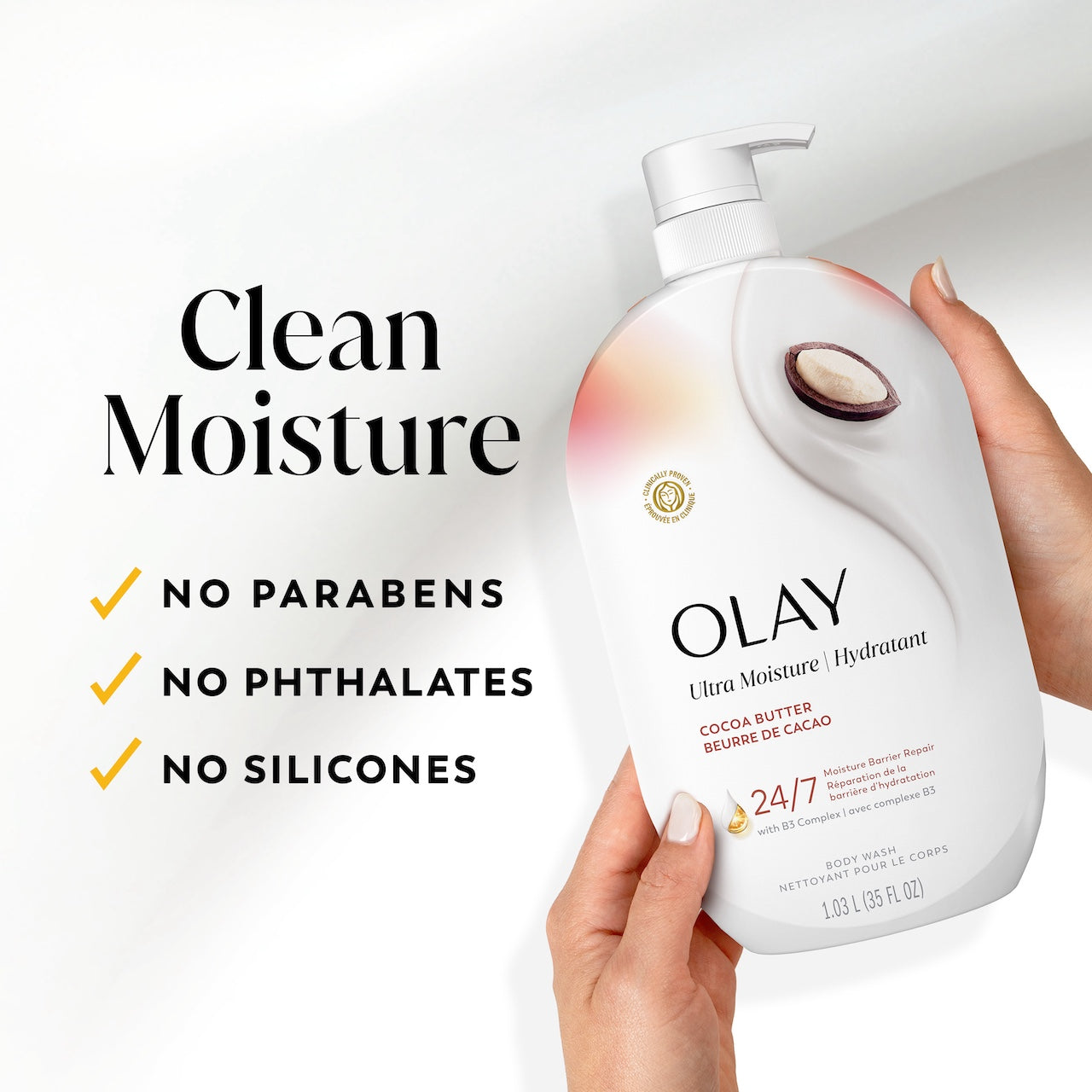 Model holding Olay Ultra Moisture Body Wash. Clean moisture. No prarbens, no phthalates, no silicones