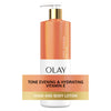 Olay Tone Evening & Hydrating Vitamin E hand and body lotion on a white background
