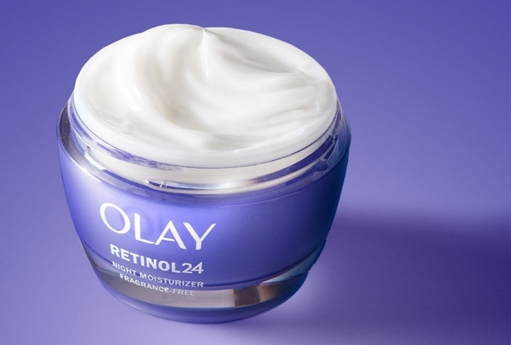 Olay Retinol 24 night moisturizer jar with cream on a purple background