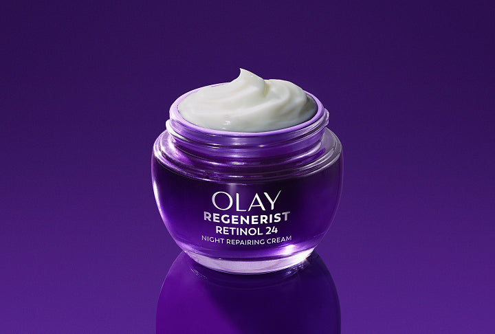 Olay Regenerist Retinol 24 night repairing cream jar on a purple background
