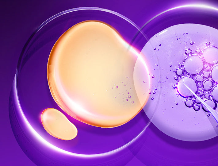 Yellow droplet and bubbles on a purple background