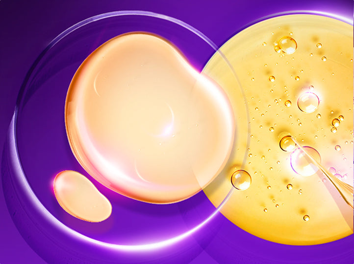 Two droplets of oil, one orange and one yellow, on a purple background.